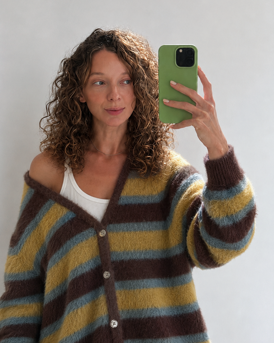 Portrait of Juana Chomnalez taking a mirror selfie
